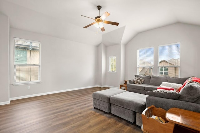 living room with ceiling fan, lofted ceiling, and dark hardwood / wood-style flooring