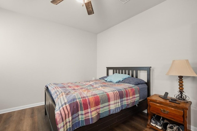 bedroom featuring ceiling fan and dark hardwood / wood-style flooring