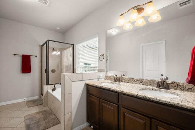 bathroom featuring tile patterned flooring, vanity, and shower with separate bathtub