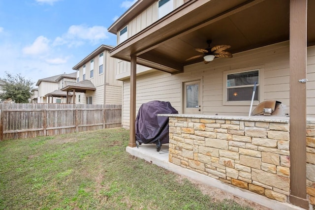 view of yard with ceiling fan