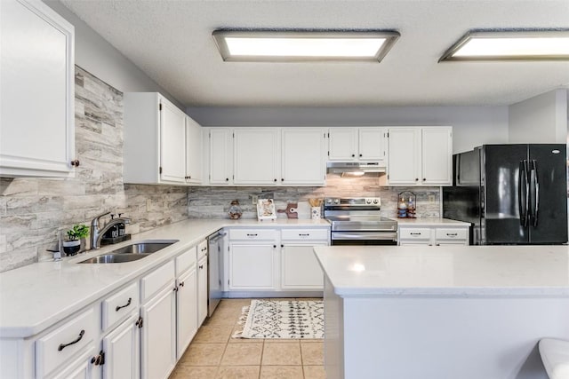 kitchen with sink, white cabinetry, stainless steel appliances, tasteful backsplash, and light tile patterned flooring