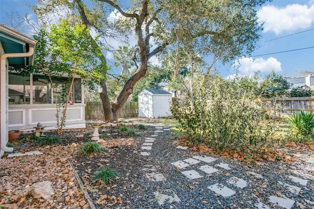 view of yard with a storage unit