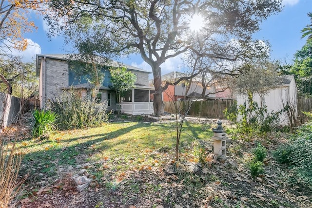 view of yard featuring a sunroom