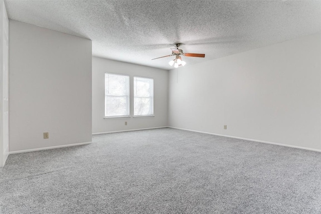 spare room with a textured ceiling, ceiling fan, and carpet flooring