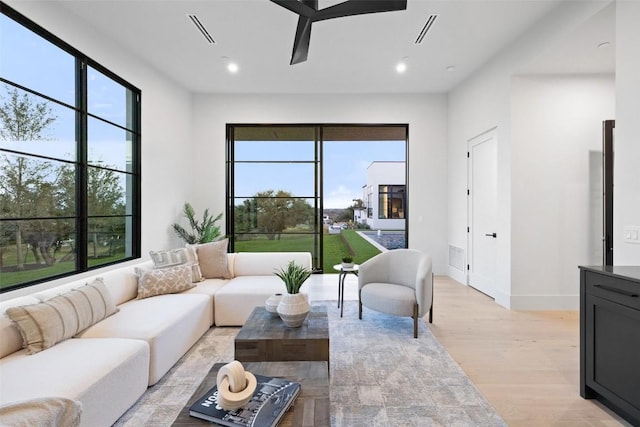 living room with light hardwood / wood-style flooring