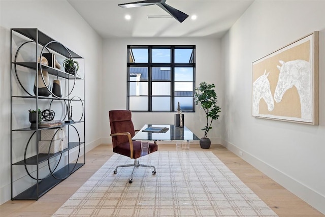 sitting room featuring ceiling fan and light hardwood / wood-style floors