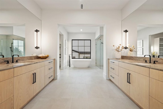 bathroom with vanity, tile patterned floors, and separate shower and tub