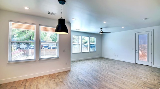 interior space with ceiling fan and light hardwood / wood-style flooring