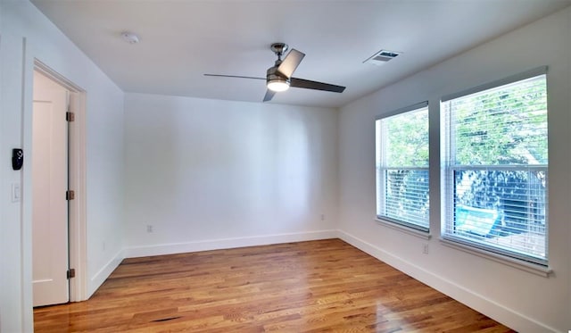 unfurnished room with ceiling fan and light hardwood / wood-style flooring