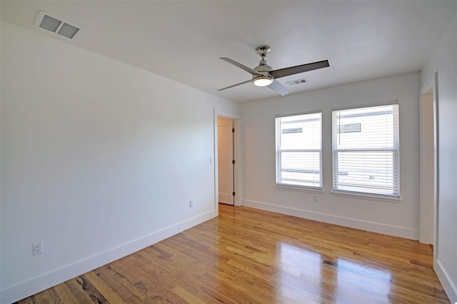 spare room with ceiling fan and light hardwood / wood-style floors