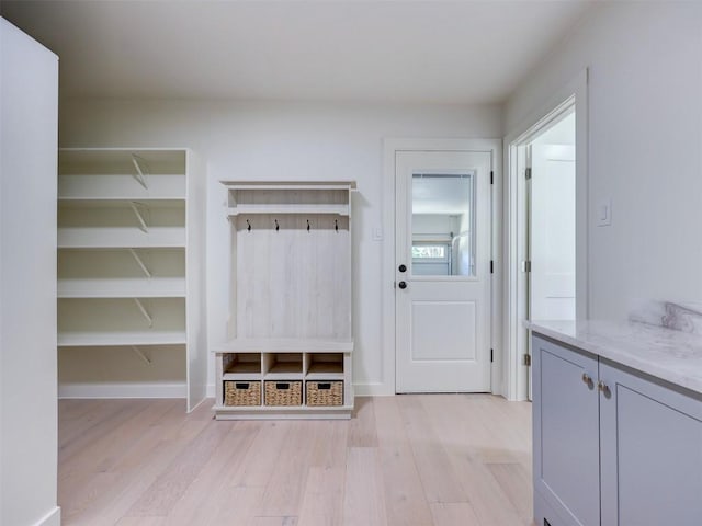 mudroom with light hardwood / wood-style floors