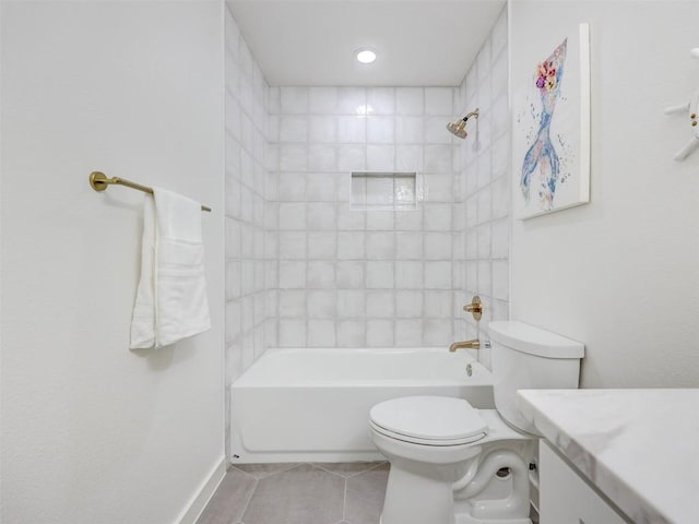 full bathroom with vanity, tiled shower / bath, tile patterned floors, and toilet