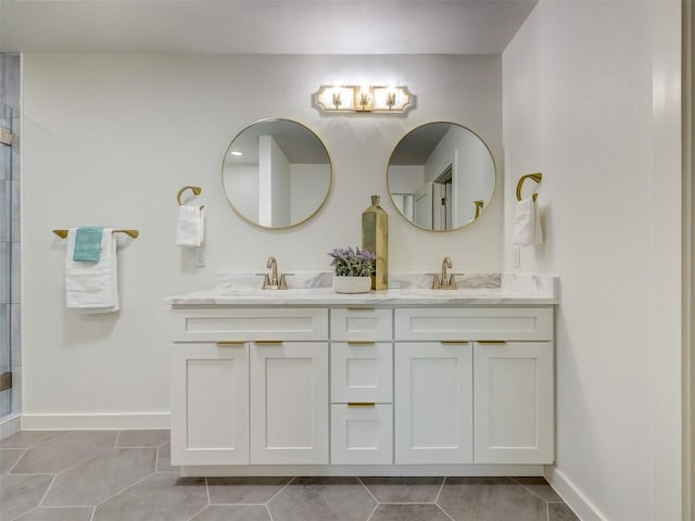 bathroom with vanity, an enclosed shower, and tile patterned flooring