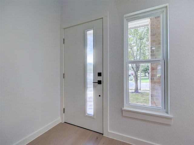 doorway with light hardwood / wood-style floors