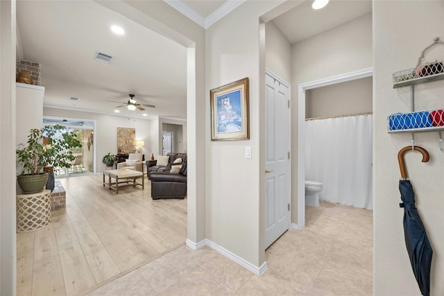 hallway featuring ornamental molding