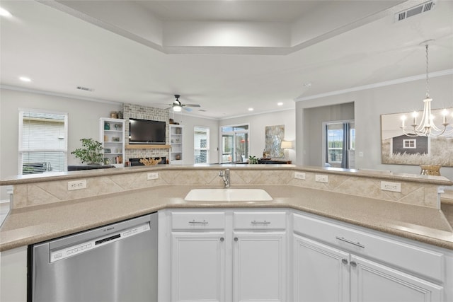 kitchen with white cabinetry, sink, stainless steel dishwasher, and crown molding