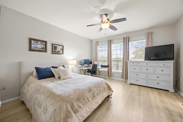 116 Granite Peak Cv, Georgetown, TX 78633 - bedroom featuring baseboards, ceiling fan, and light wood-style flooring