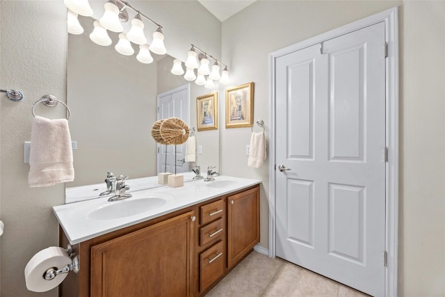 116 Granite Peak Cv, Georgetown, TX 78633 - bathroom with double vanity, a sink, and tile patterned floors