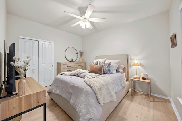 116 Granite Peak Cv, Georgetown, TX 78633 - bedroom with baseboards, ceiling fan, a closet, and light wood-style flooring