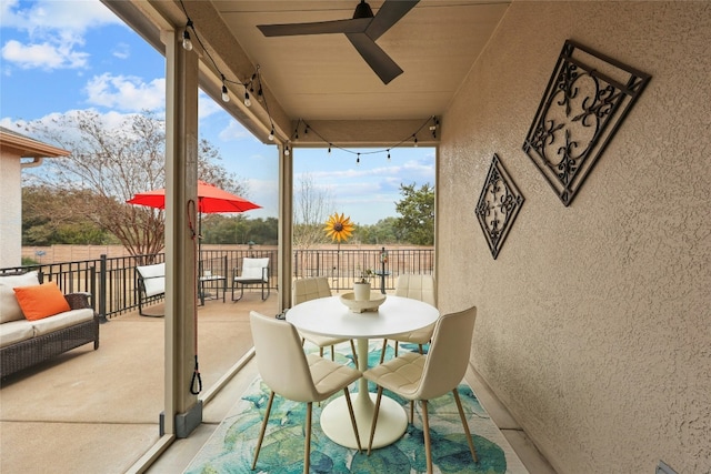 exterior space with ceiling fan