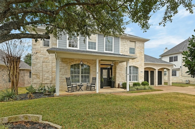 view of front of home featuring a front lawn and a porch