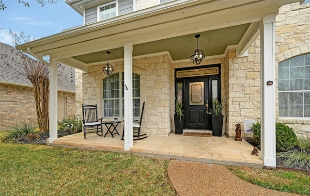 view of exterior entry featuring a porch