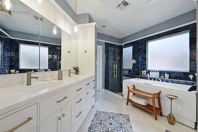 bathroom featuring tile patterned floors, separate shower and tub, vanity, and backsplash