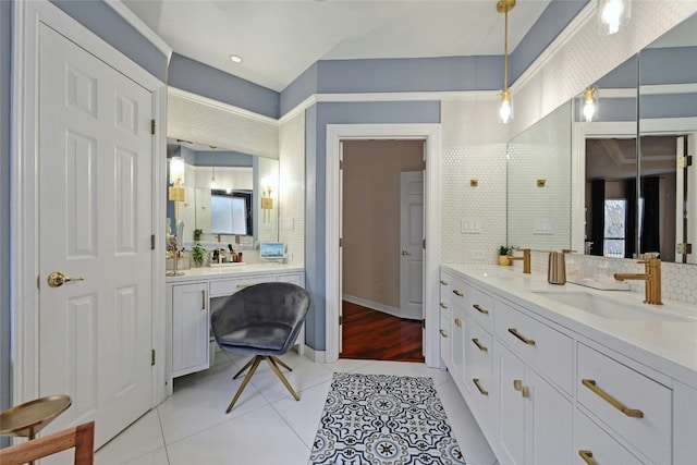 bathroom featuring vanity, tile patterned flooring, and decorative backsplash