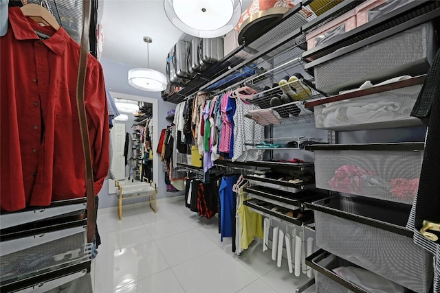 spacious closet featuring light tile patterned floors