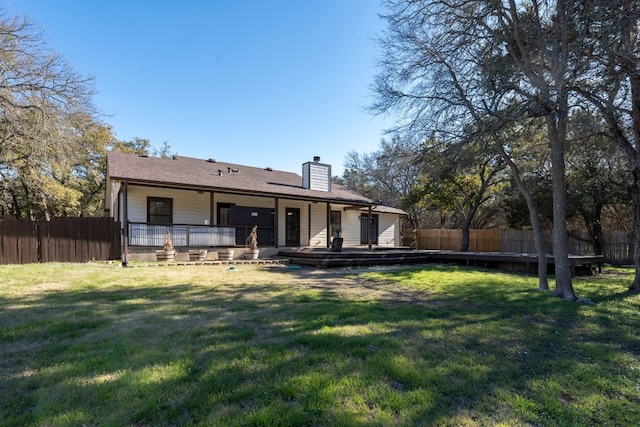 rear view of house with a lawn