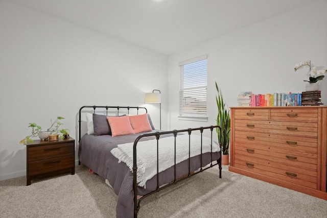 bedroom with light colored carpet