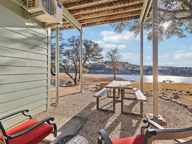 view of patio with a water view