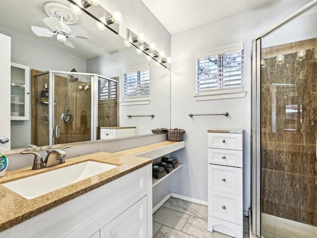 bathroom featuring vanity, ceiling fan, and walk in shower