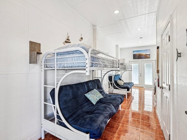 tiled bedroom with french doors