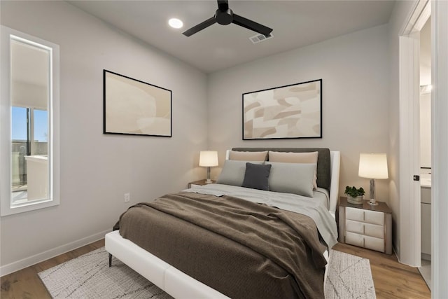 bedroom featuring light hardwood / wood-style floors and ceiling fan