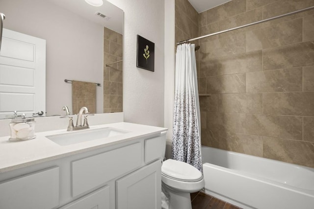 120 Red Granite Rd, Georgetown, TX 78633 - full bathroom with toilet, vanity, shower / bathtub combination with curtain, and wood finished floors