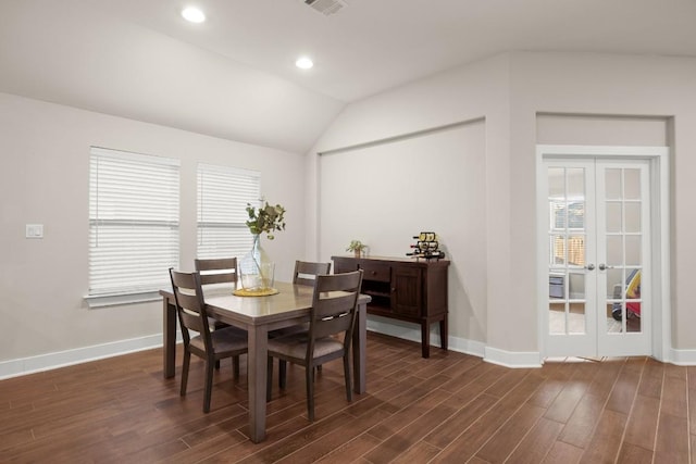 dining space featuring french doors, dark hardwood / wood-style flooring, and vaulted ceiling