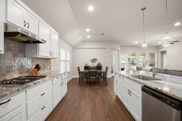 kitchen with appliances with stainless steel finishes, sink, and white cabinets