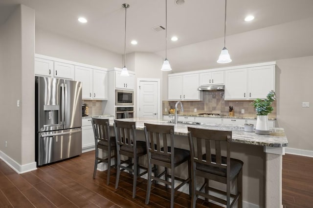 120 Red Granite Rd, Georgetown, TX 78633 - kitchen with stainless steel appliances, a sink, decorative backsplash, dark wood-style floors, and baseboards