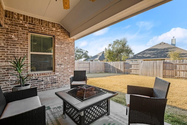 view of patio with an outdoor fire pit