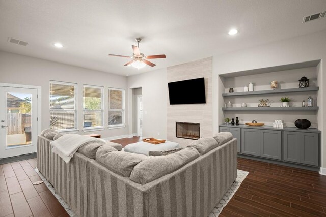 120 Red Granite Rd, Georgetown, TX 78633 - living room with a ceiling fan, a fireplace, dark wood-style floors, recessed lighting, and baseboards