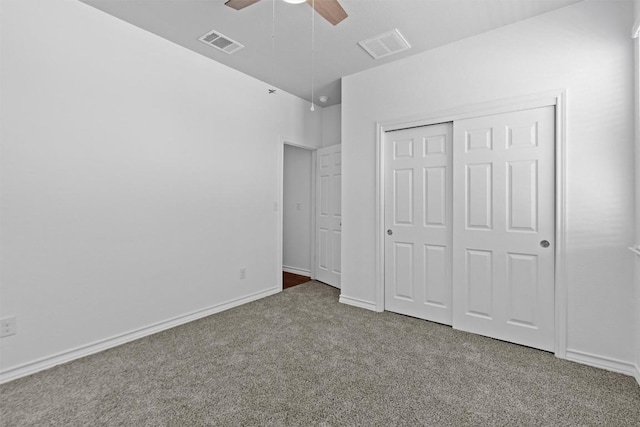 unfurnished bedroom with ceiling fan, carpet floors, and a closet