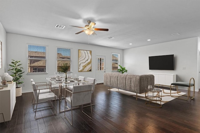 dining area featuring dark wood-type flooring and ceiling fan