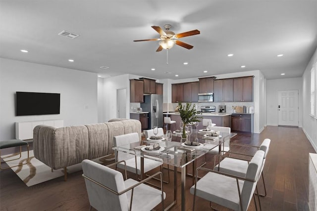 dining area featuring dark hardwood / wood-style floors and ceiling fan