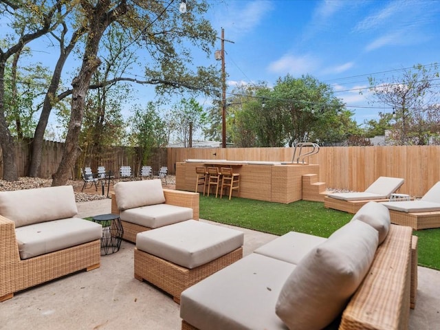 view of yard with an outdoor hangout area, an outdoor bar, and a patio area