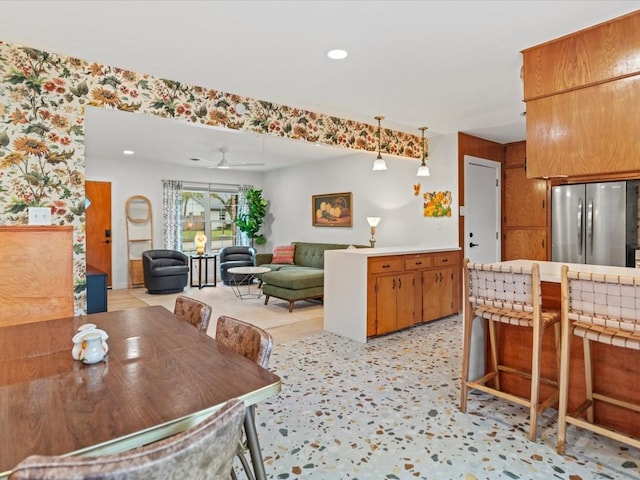 dining room featuring ceiling fan