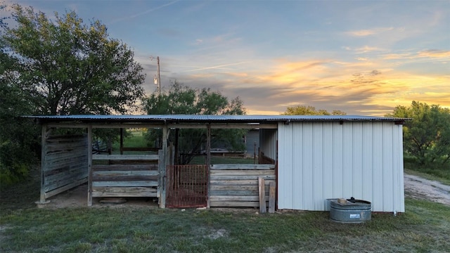 view of outdoor structure at dusk