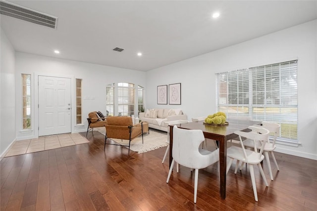 dining area featuring dark wood-type flooring