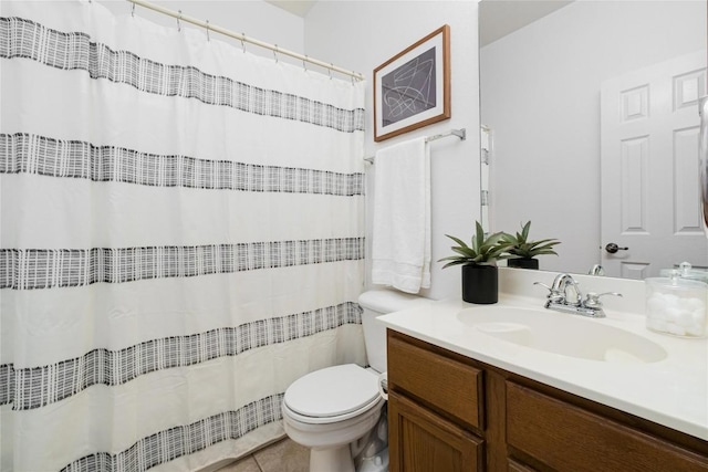 bathroom with vanity, tile patterned floors, and toilet