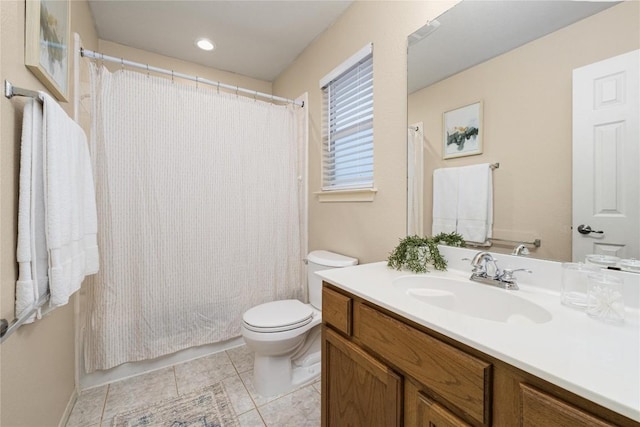 bathroom with vanity, tile patterned floors, and toilet